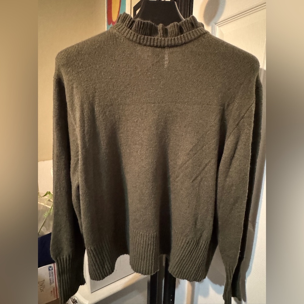 Sorry no label. Olive green, long sleeve sweater with ruffled neckline